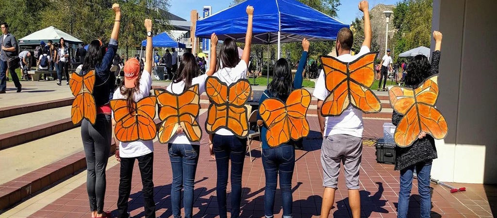 Group of Undocumented Students with butterfly wings on them