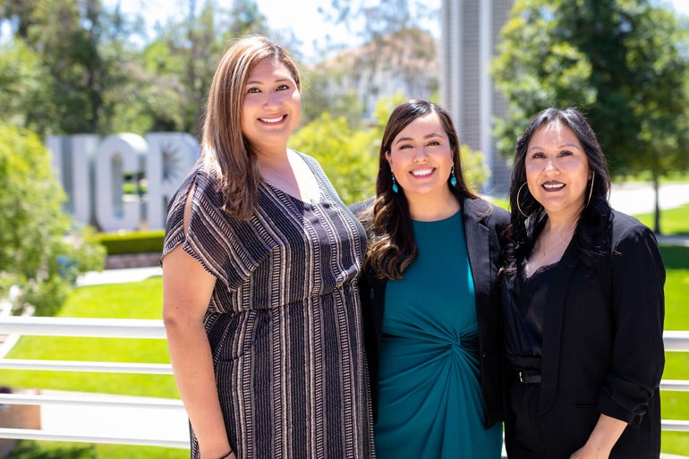 A group photo of staff of Chicano Student Programs, pictured from left to right: Alice Chavez, Arlene Cano Matute, and Estella Acuña
